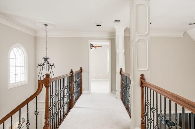Building Photo - Elegant Master-on-Main in Prestigious Laur...