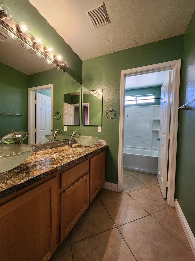 Building Photo - Rhodes Ranch 4 Bed Home | Guard-Gated Community | Trash & Sewer Included