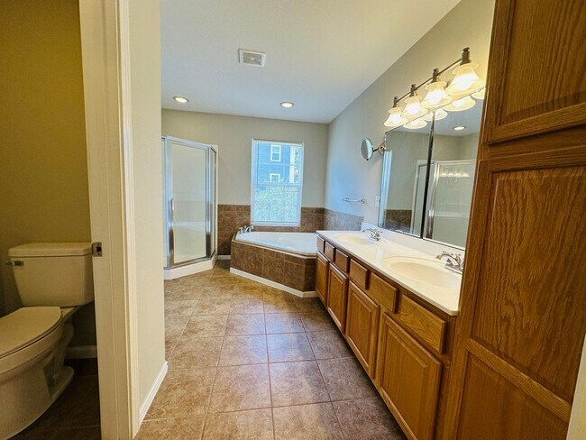 Building Photo - 2 bed, 2.5 bath updated townhouse w/ 1-car garage & Trex deck available now