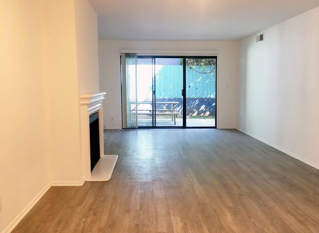 Living Room open to east facing balcony - 4627 Finley Ave