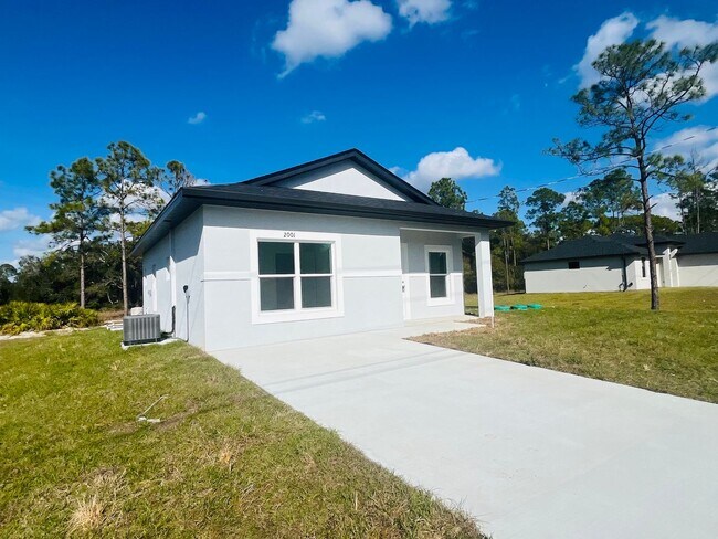 Building Photo - Brand New 2/2/1 - Lehigh Acres