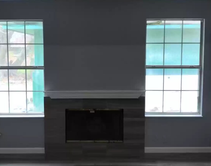 Living Room with Wood Fireplace - 10335 Glenkirk Dr