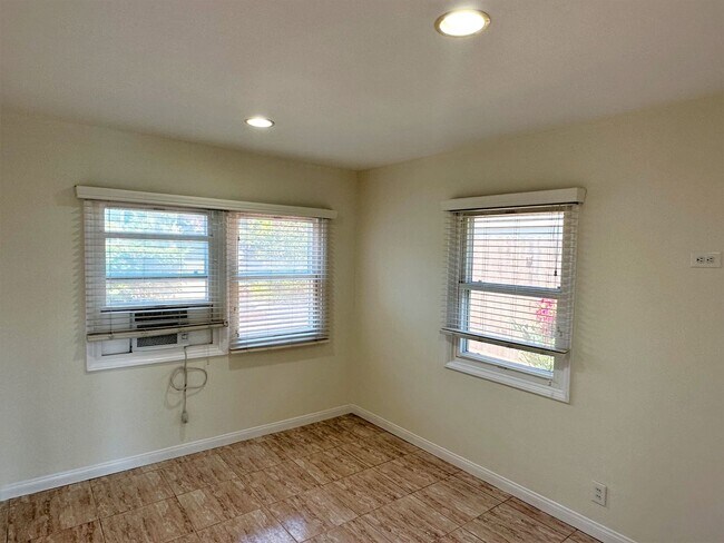 Building Photo - Charming 2+1 PDR hills home w/ large lot. Jacuzzi, decks, fireplace, view, walk to the beach!