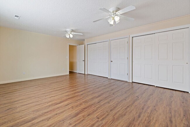 Building Photo - SPACIOUS LAYOUT! HARD SURFACE FLOORING, FENCED YARD & LARGE PATIO!