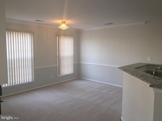 Building Photo - Welcome to this beautifully appointed two level upper condominium that combines modern style with...