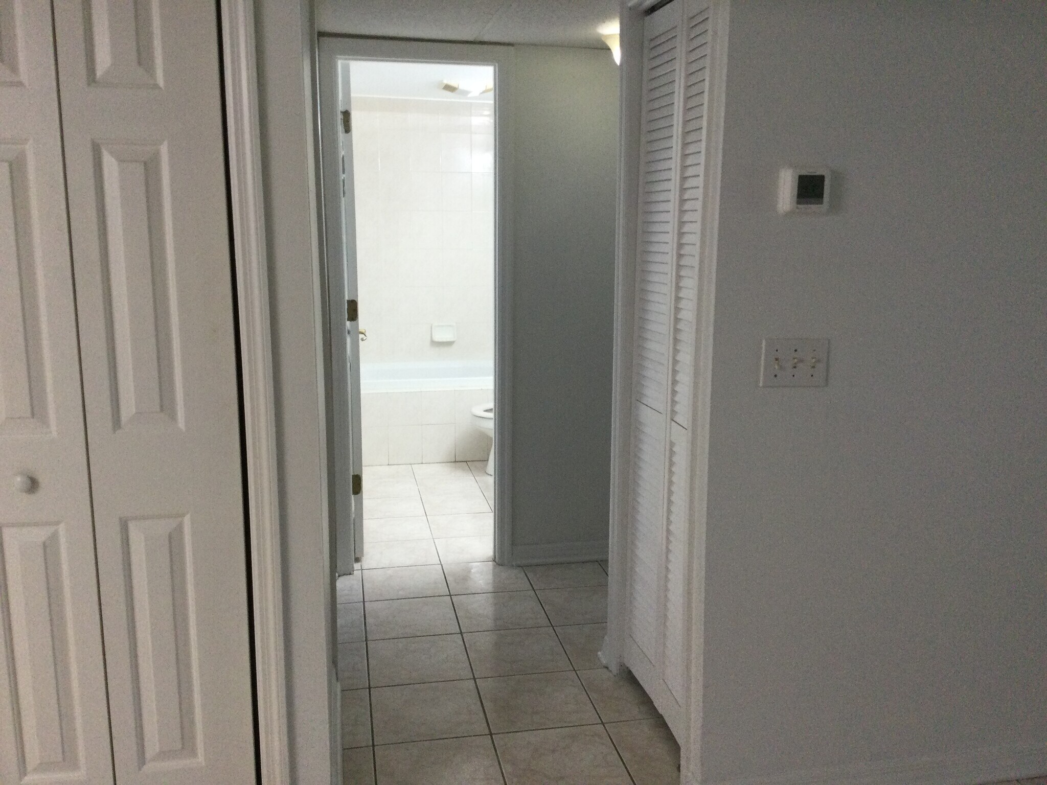 Looking toward Bathroom #1 from Living Room - 8610 Huron Ct