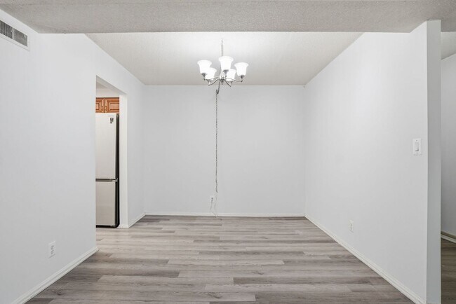 Building Photo - This expansive ground level residence is set within a serene, gated garden community surrounded b...