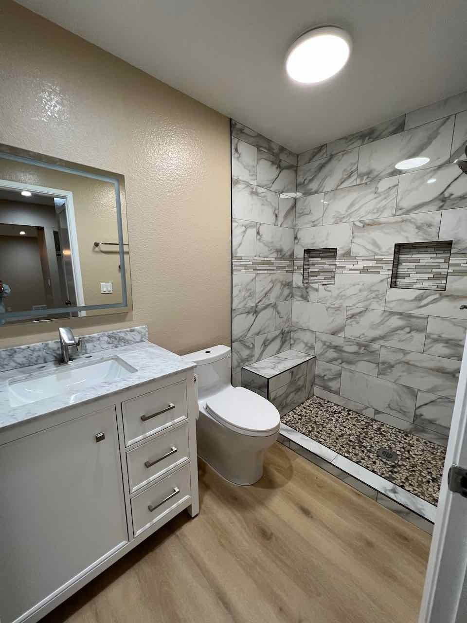 Newly remodeled bathroom with white cabinetry, custom tile walk-in shower, toto toilet - 3183 Wayside Plz