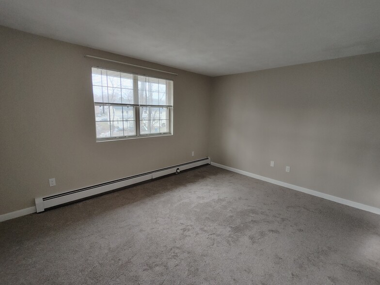 Master bedroom with new carpet, paint, baseboard, blinds, and outlets - 9 Kenmar Dr