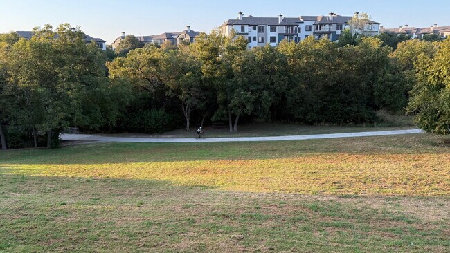 Building Photo - Updated 2 Bed/2 Bath North Austin Condo with Rare Greenbelt Views