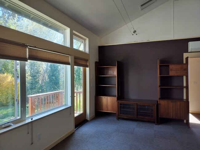 Living room with custom booksehlves and entertainment center - 16261 SE Sun Ave