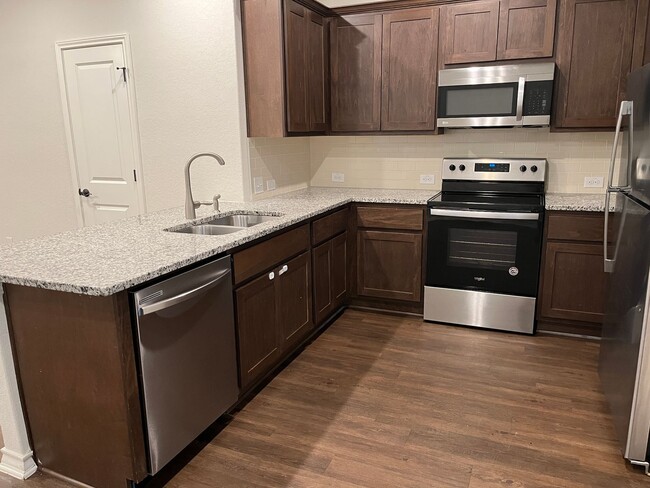 Building Photo - Move Fast! Gated Townhome Near Lackland AFB with Private Yard & EV-Ready Garage
