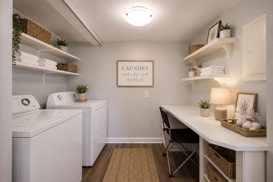 Dedicated laundry room with full-size washer and dryer, built-in shelving, and additional workspace - 3000 Hillsboro Pike