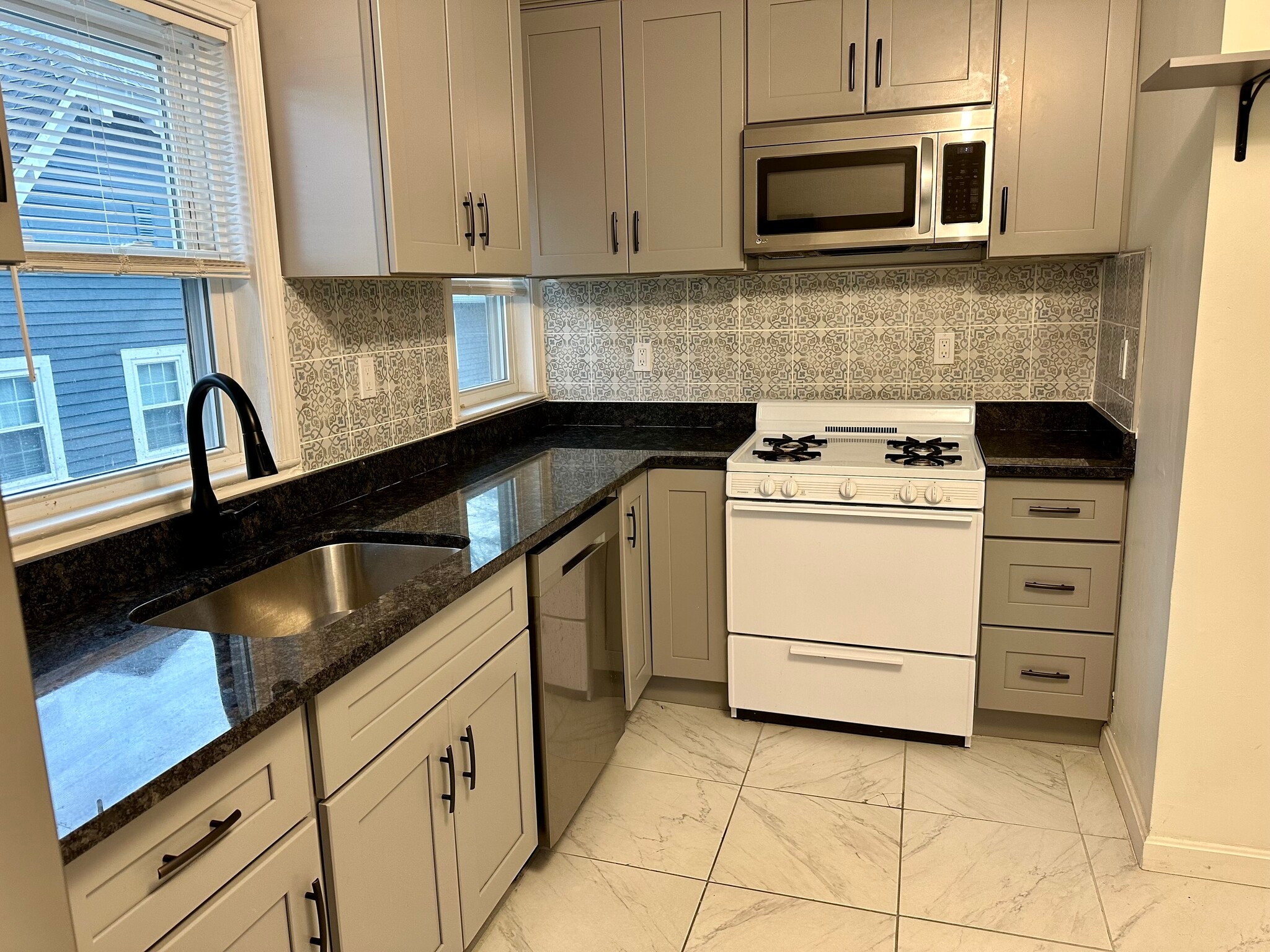 Gas stove is updated. Old stove in photo. - 8 Avon St