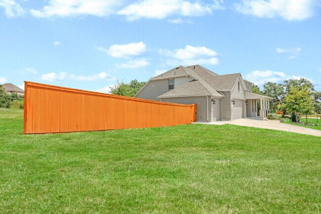 Building Photo - "Spacious 4-Bedroom Sanctuary with Cozy Fireplace in San Antonio's Prime Location!"