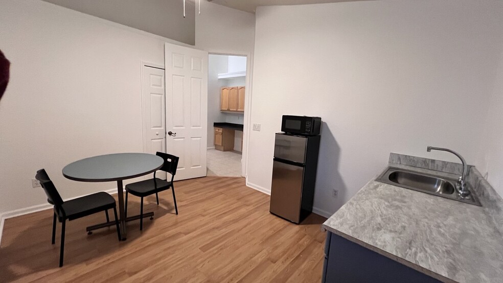 Kitchennette includes dinner table, microwave, fridge, sink, and electric stove - 3540 Maple Ridge Loop