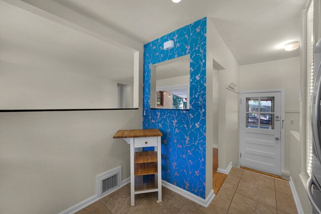 Kitchen with coffee nook overlooking living room and back yard. - 114 N Foote Ave