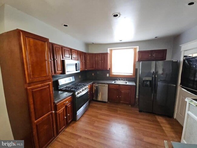 Building Photo - 5736 Woodcrest Ave