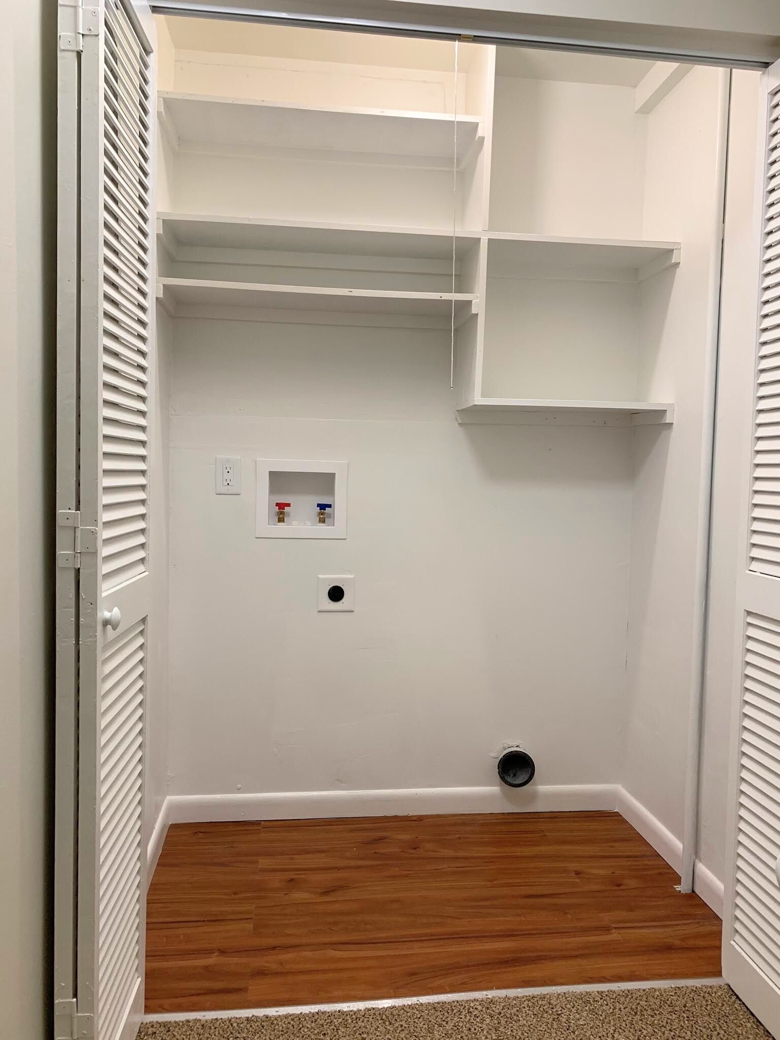 Washer and dryer hookups in a closet at the top of the stairs. This is *not* an actual picture of the property. This is a picture of an identical unit in the same complex with similar finishes. Actual photos will be uploaded after 4/1/21 when the new carpet is installed. - 1005 Willow Green Dr