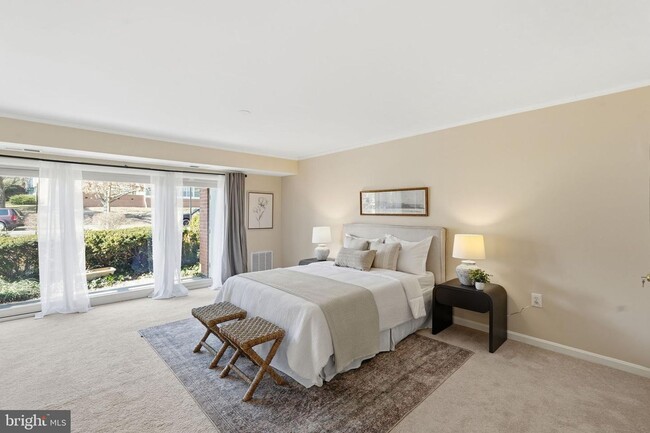 Building Photo - Welcome to this rarely available and beautifully updated ground-level condo offering the perfect ...