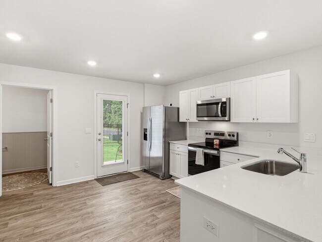 Building Photo - Newly Built 3BD, 2.5BA End Unit Raleigh Townhome with a Fenced Yard in a Prime Location