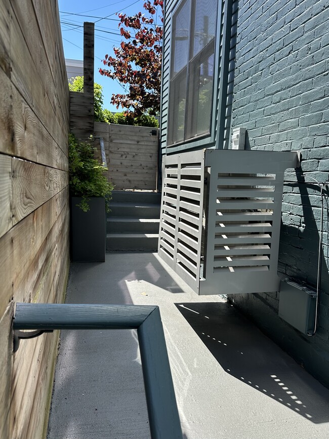 Private outdoor space with a gate leading to the back alley (where trash and recycling is) - 112 4th St NE