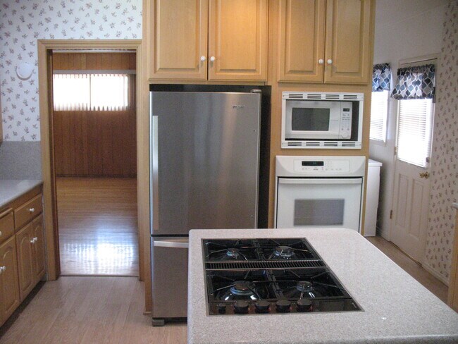Kitchen View - Loads of Cabinet Space. Kitchen has recessed lighting with dimmer - 3121 W Wyoming Ave