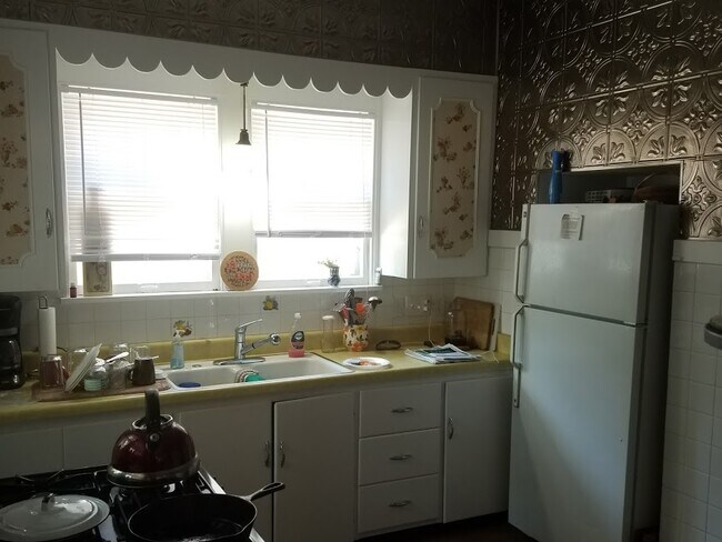 smaller kitchen with all appliances and historic panels - 1801 E 12th St