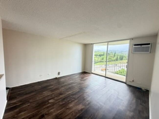 Building Photo - Welcome to your new home at Pearlridge Gardens & Tower! This 1-bedroom, 1-bathroom condo $2,100