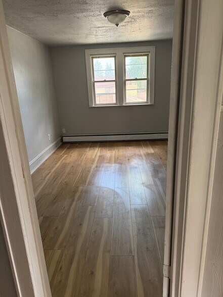 Master bedroom with walk in closet - new flooring - N89W15958 Main St