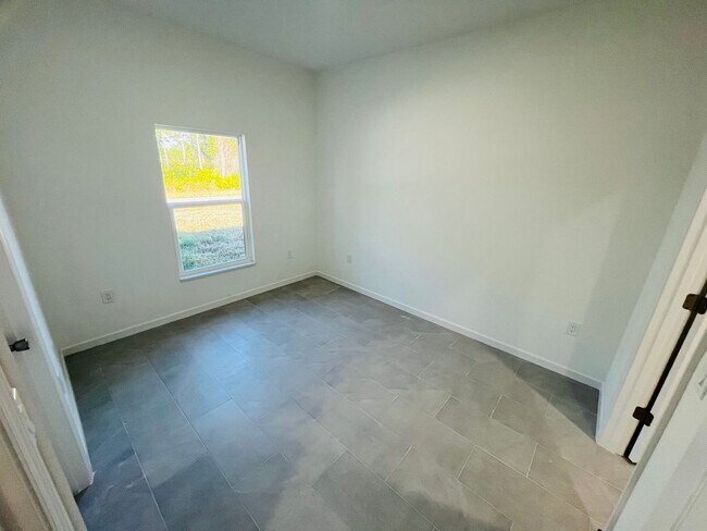 Building Photo - BRAND NEW ONE BEDROOM, ONE BATH-ONE CAR GARAGE- SOUTH LEHIGH ACRES
