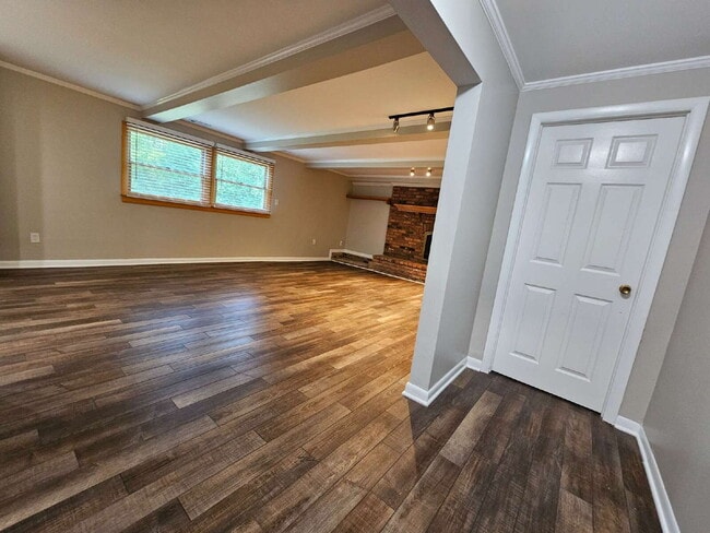 Building Photo - Private 4 Bedroom Home on 0.75 Acres with Great Room Fireplace, Wet Bar & 3-Season Room, 2 Car At...
