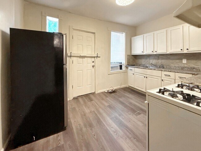 Building Photo - Charming Baltimore Rowhome with Updated Kitchen, Covered Front Porch & Basement