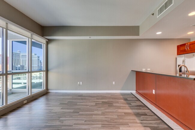 Building Photo - Iconic Strip-View Luxury | Elegant 1BR + Den High-Rise Residence