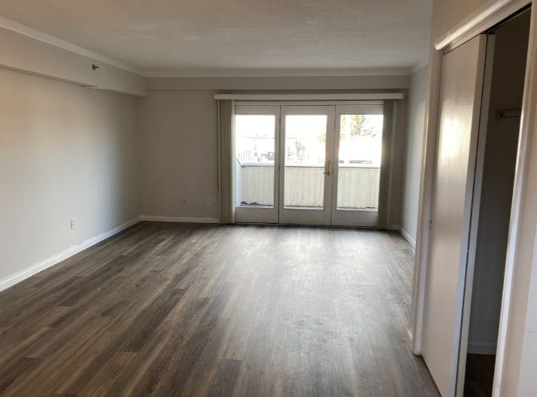 Open Living Room & Dining Area with French Doors to Terrace - 281 Browertown Rd