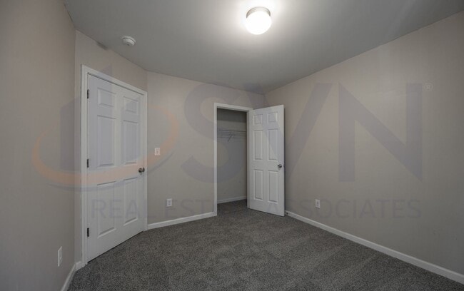 Building Photo - Welcome to this spacious 4-bedroom, 2.5-ba...