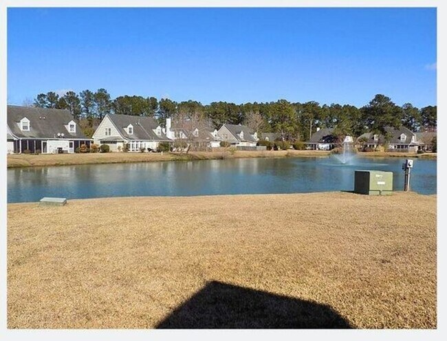 Building Photo - Spacious Condo with Expansive Pond Views