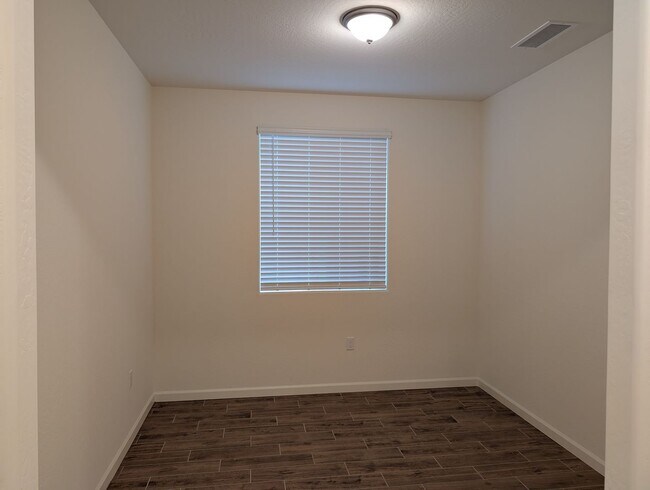 Building Photo - New Wilson home offering modern amenities, solar and a nice floor plan. Bonus room with den or of...