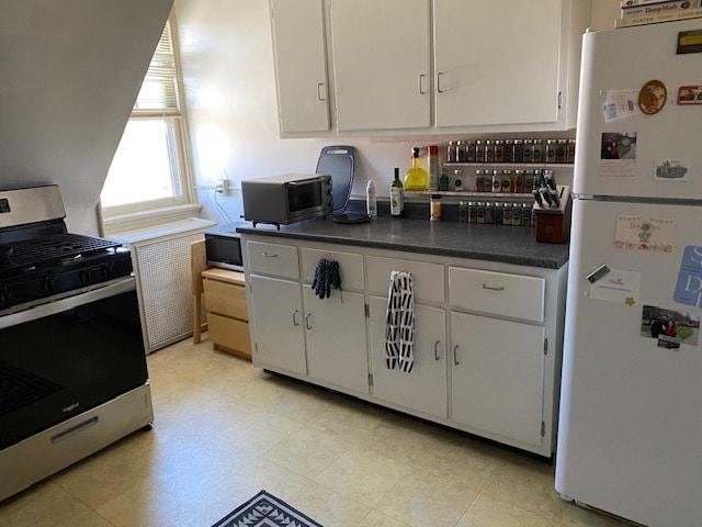 Kitchen with new gas stove. Lots of cabinets - 1360 Denniston St