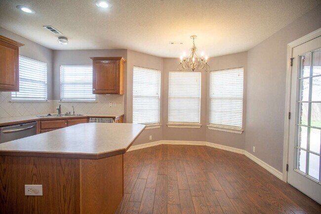 Building Photo - "Spacious 4-Bed Home with Granite Touch & ...