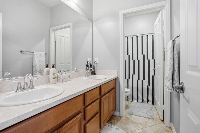 Building Photo - Highly Sought-After Next Gen Home with Private Downstairs Suite in Gated Valencia Community