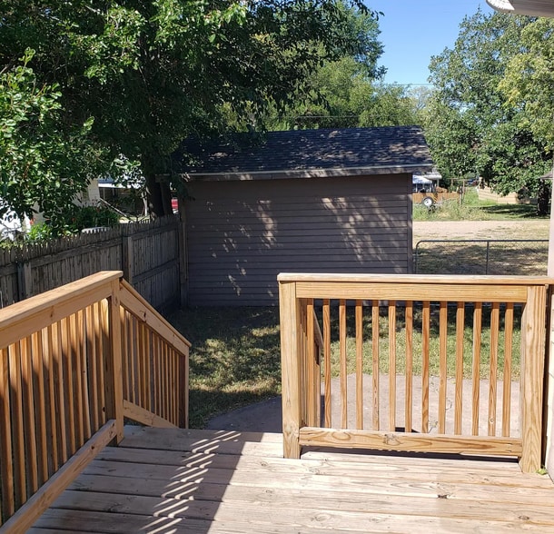 Deck Leading to Fenced in Back Yard - 709 N Rowley St