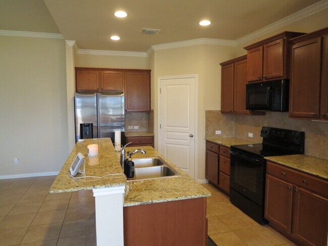 Building Photo - "Charming 4-Bed Oasis with Granite Touches...