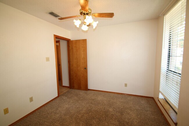 Building Photo - Corner Lot Charmer Off Chapel Creek | 4BR/2BA with Fireplace, Garden Tub & Fenced Backyard