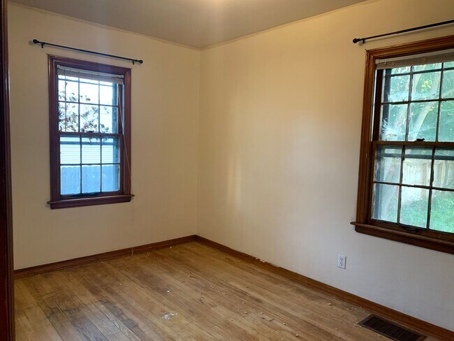 Building Photo - Three bedroom home with beautiful hardwood floors and central air!
