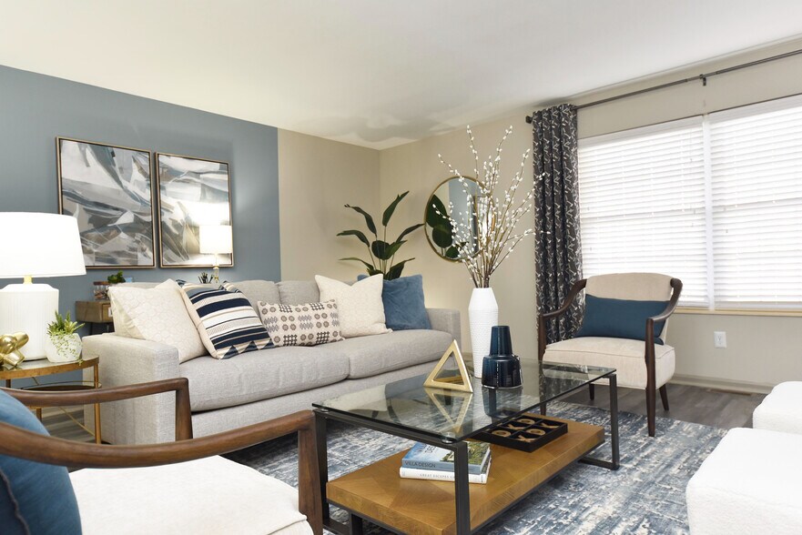Experience tranquility in this elegantly designed living room, perfect for relaxation and entertaining. - Everly at Meridian Hills