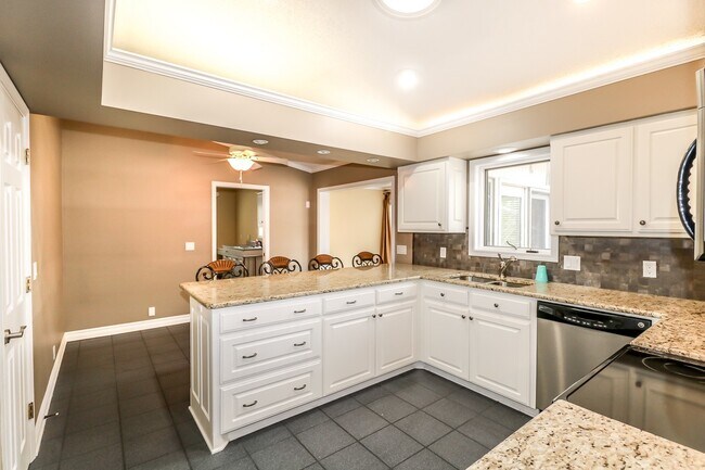 Building Photo - Beautiful 4 Bedroom, 3 Bath home. It has a 2 car garage plus a 1 car carport.  Stay warm in the w...