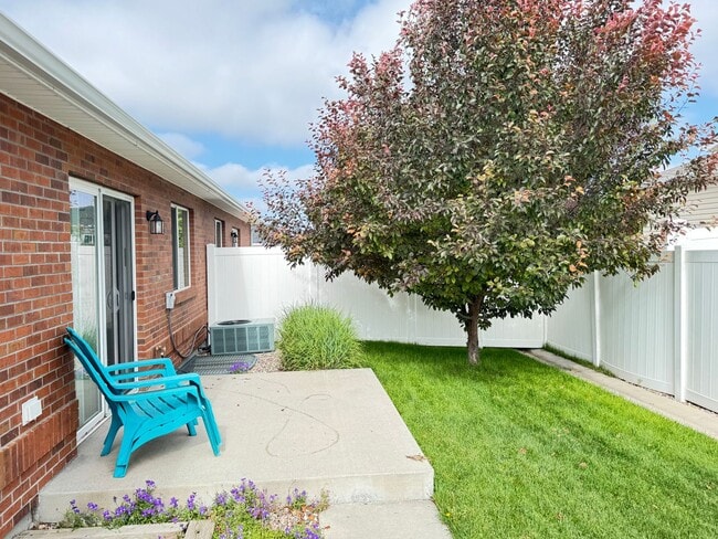 Building Photo - 4 BEDROOM, 3 BATHROOM TWINHOME WITH 2 CAR ATTACHED GARAGE IN NORTH CHEYENNE