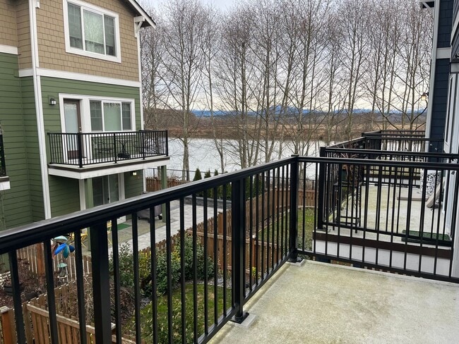 Building Photo - Riverfront Townhome with Tandem Garage & Fenced Yard