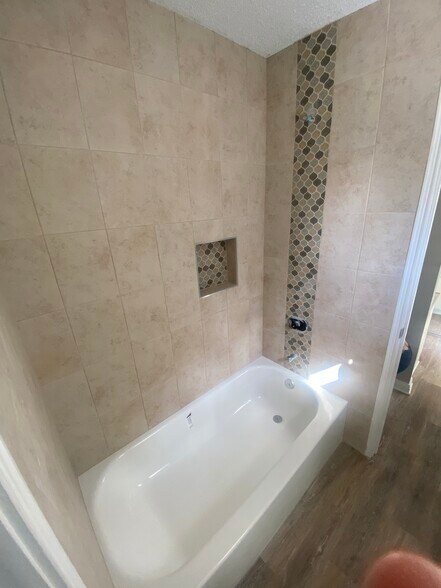 Updated Bathtub with new Ceramic Tile - 913 St Landry St
